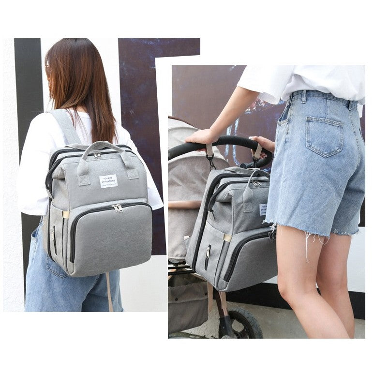 Rucsac Multifunctional pentru Mamici, cu Patut Pliabil si Baza de Schimbat, Rezistent la Apa, Capacitate Mare, Usor, Compartimente Multiple, Buzunar Termic pentru Lapte, 42 x 32 x 22 cm, Gri